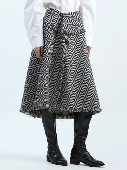 Black-and-white striped skirt with tassel trim