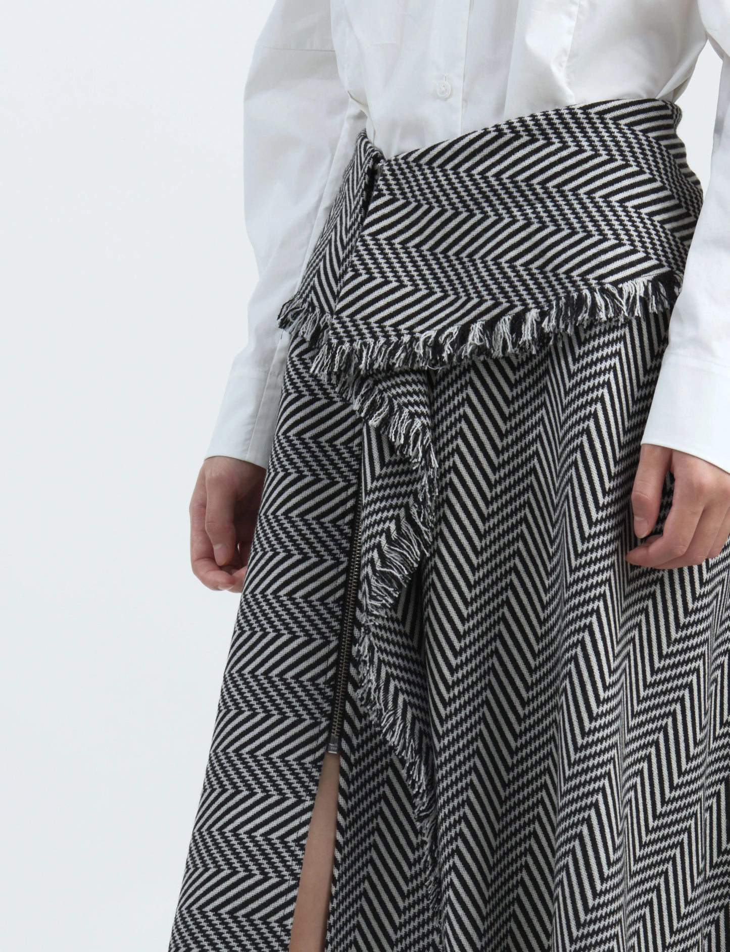 Black-and-white striped skirt with tassel trim