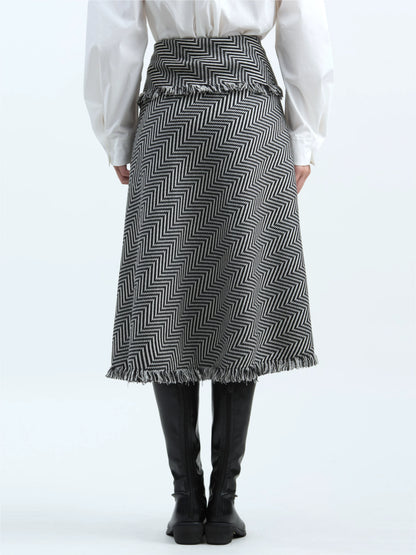 Black-and-white striped skirt with tassel trim