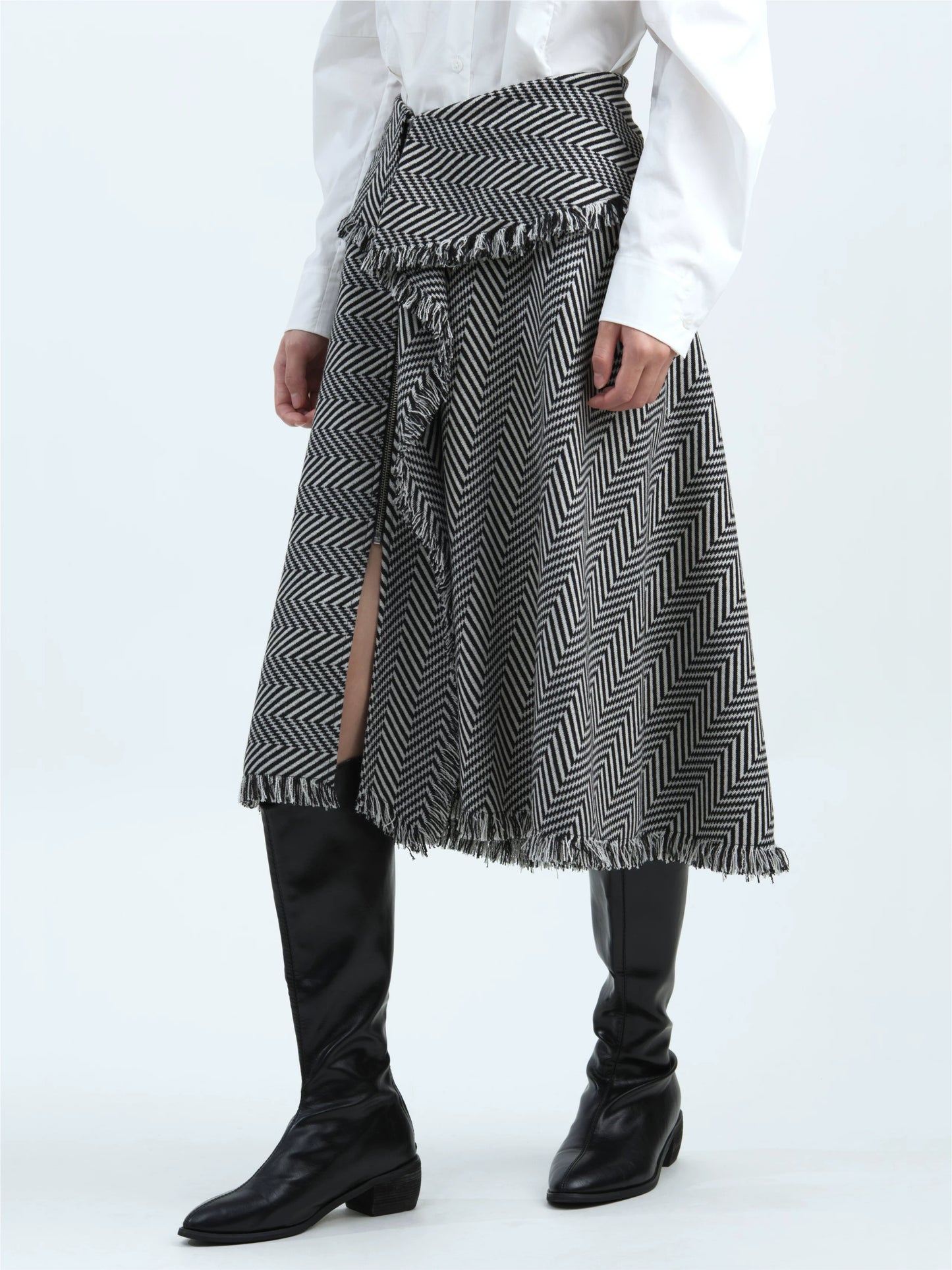 Black-and-white striped skirt with tassel trim