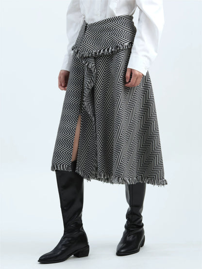 Black-and-white striped skirt with tassel trim