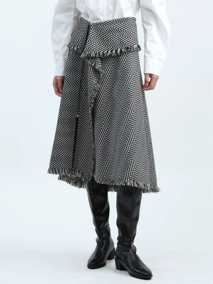 Black-and-white striped skirt with tassel trim